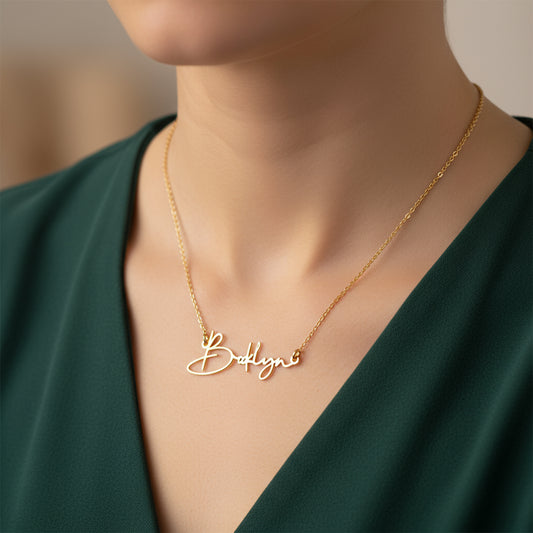 Model wearing Zaera Autography personalised signature name necklace, handcrafted 22k gold plated pendant with elegant cursive design and minimalist jewellery style.